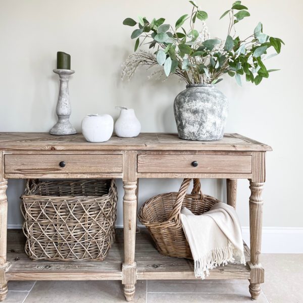 Rustic console table with decor.